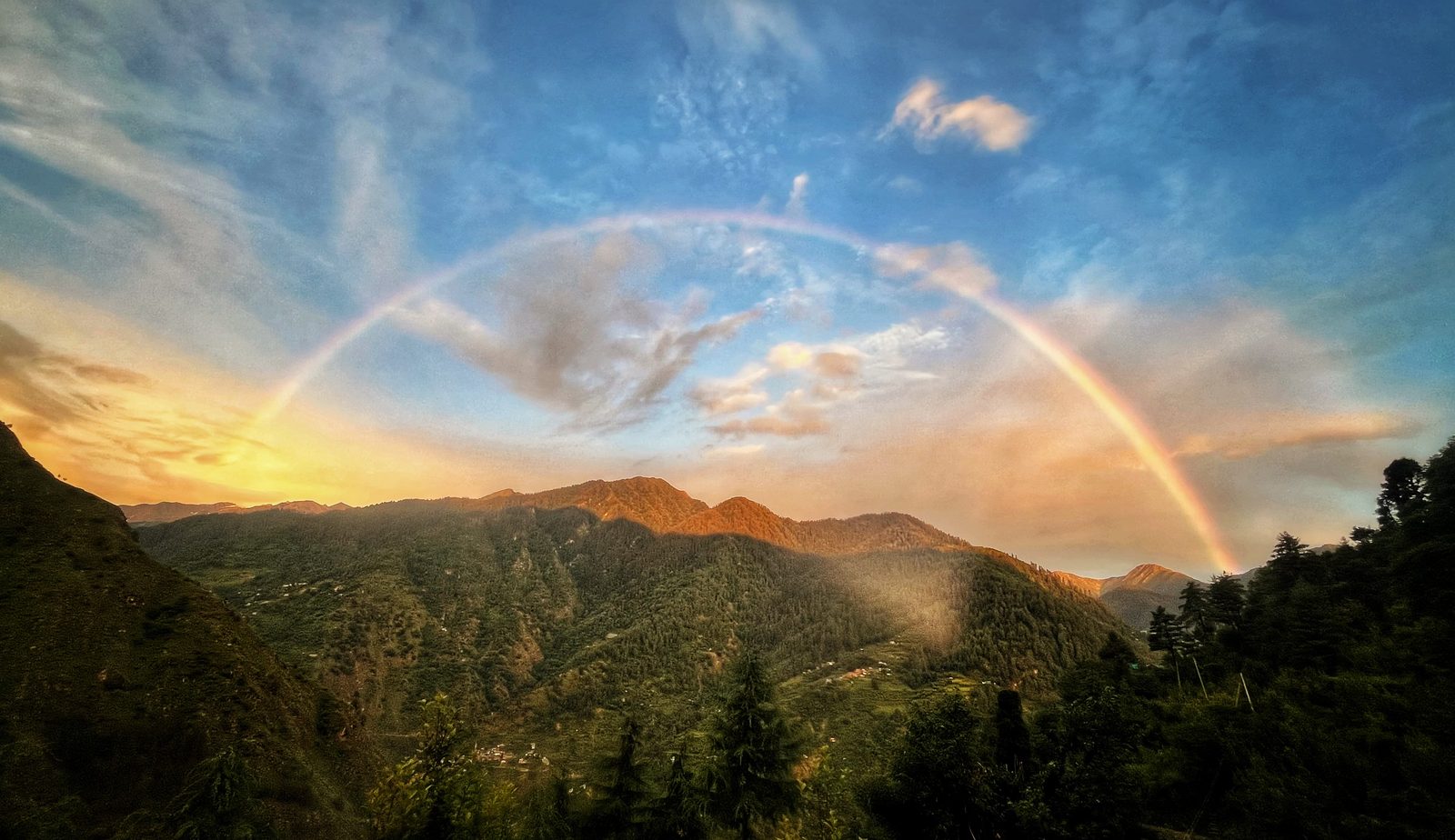 Himalayan landscape with rainbow